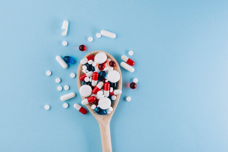 1734526723_various-pills-wooden-spoon_23-2147983104